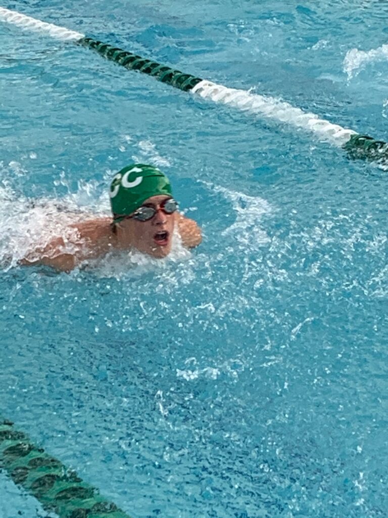 boy competing at swim meet