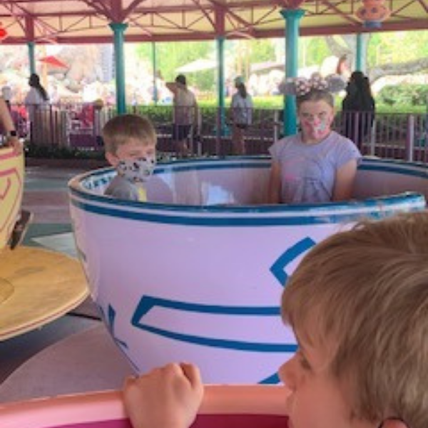 girl and boy on teacups