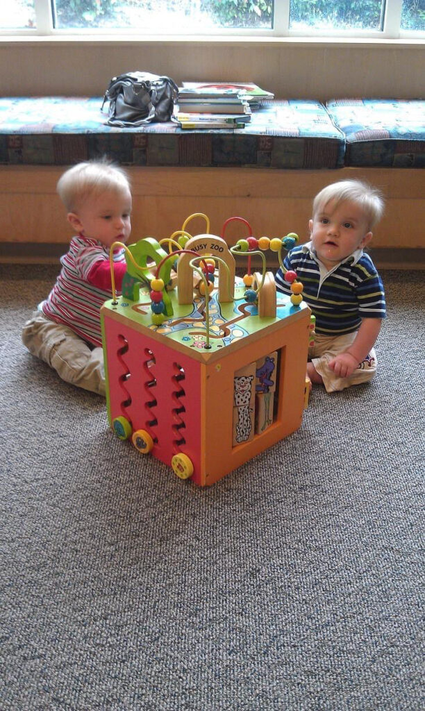 special needs boys playing with developmental toy