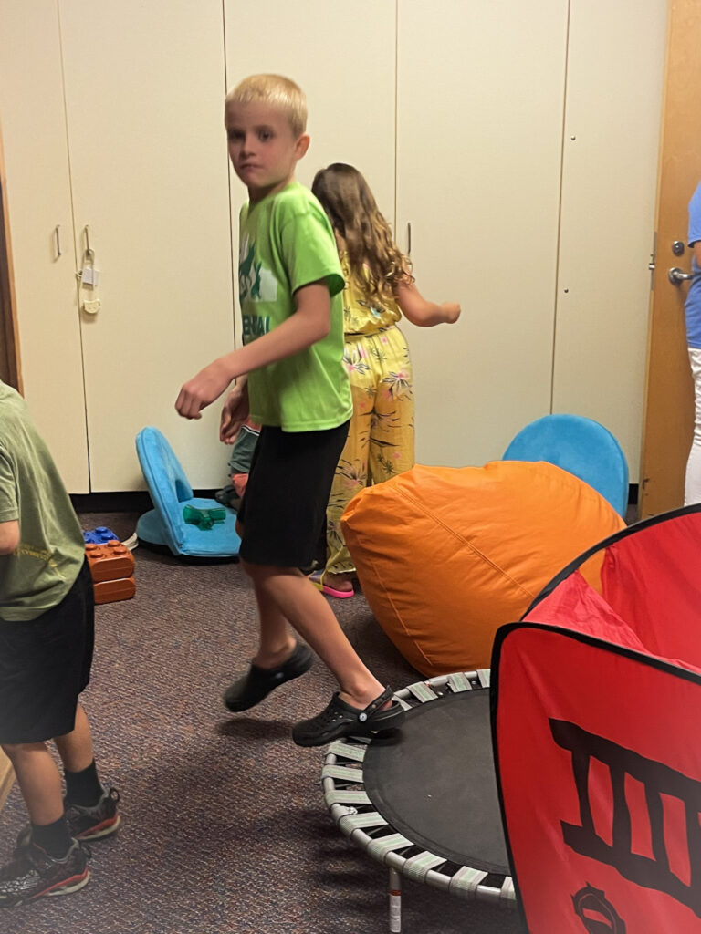 boy on mini- trampoline