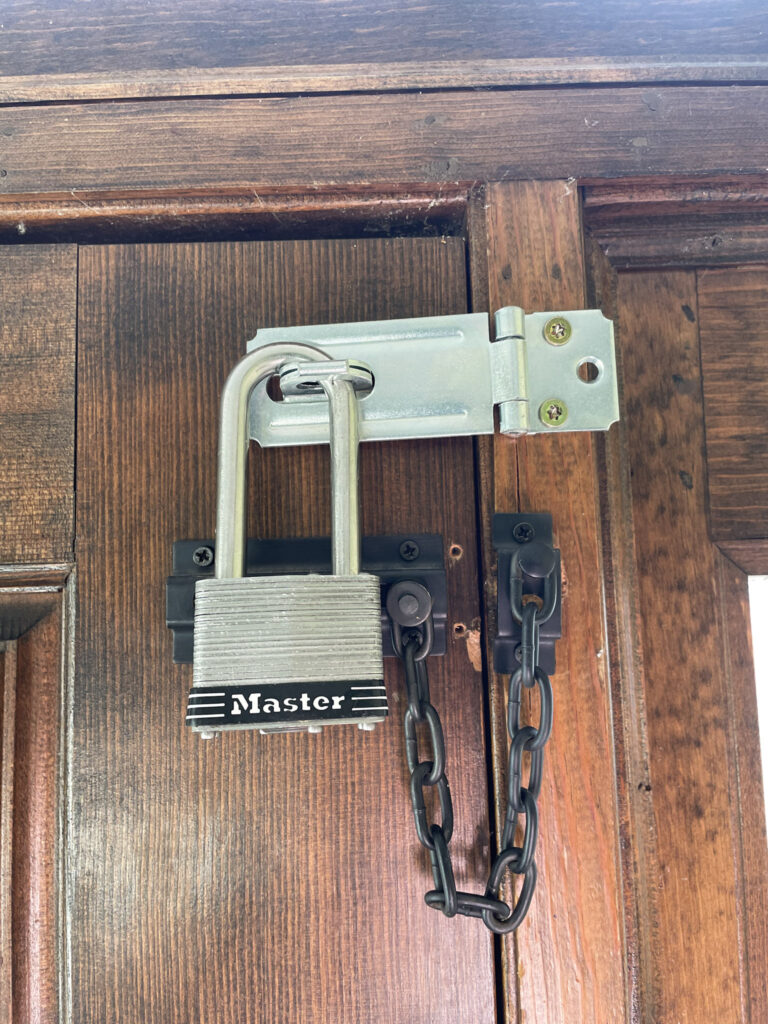 padlock and chain lock on exterior door