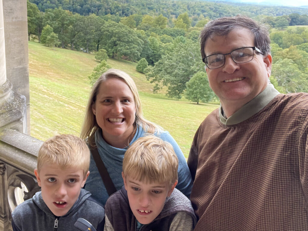 parents and 2 boys on loggia at Biltmore Estates
